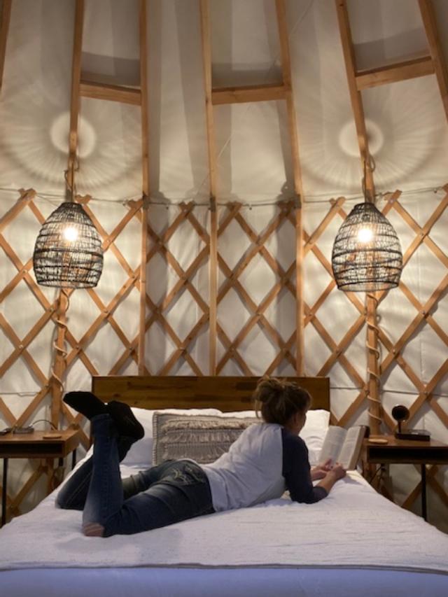 Jodi Bird relaxing in a yurt